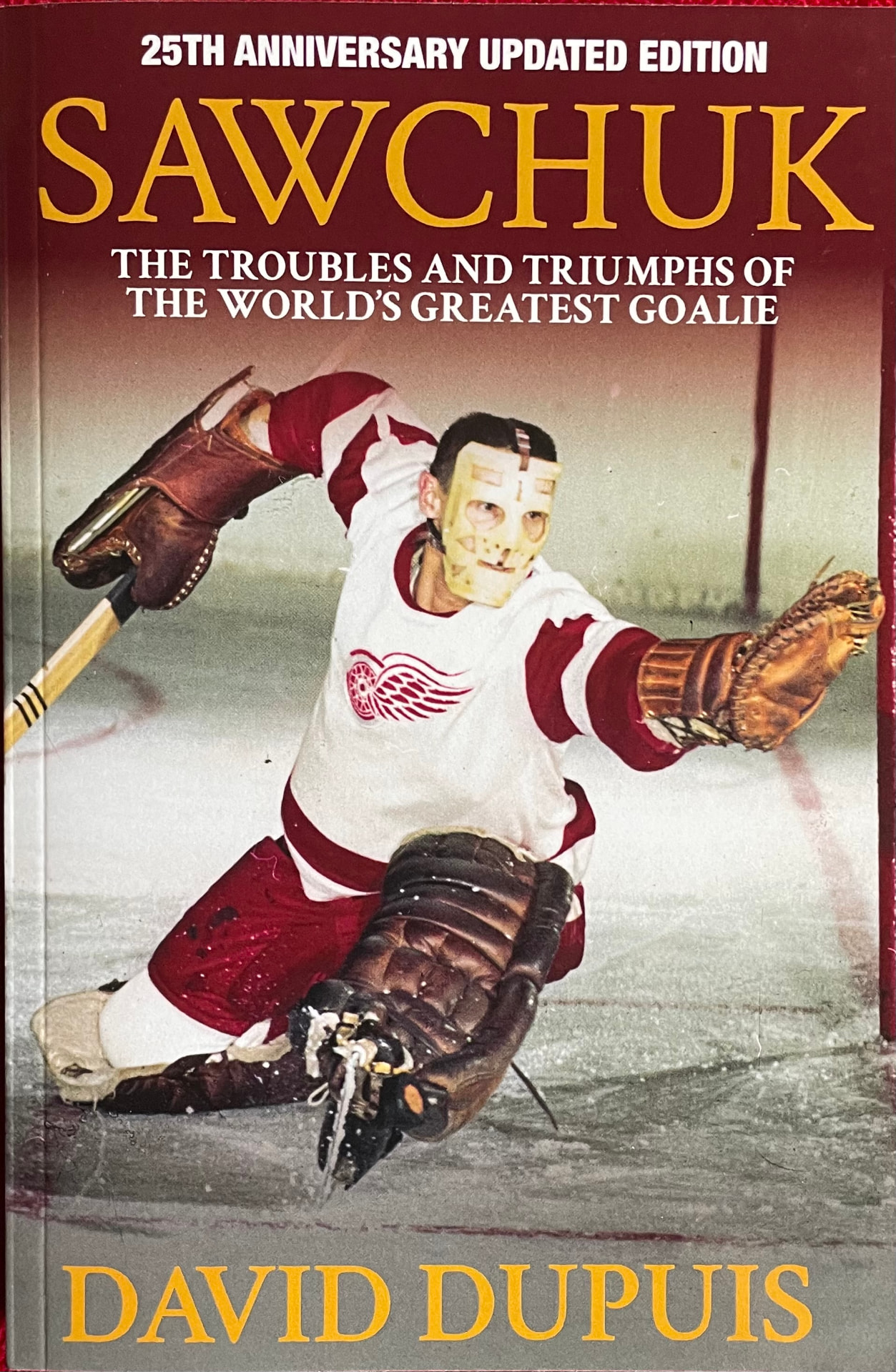 25th Anniversary Updated Edition of Sawchuk by David Dupuis, featuring Terry Sawchuk in his Detroit Red Wings uniform